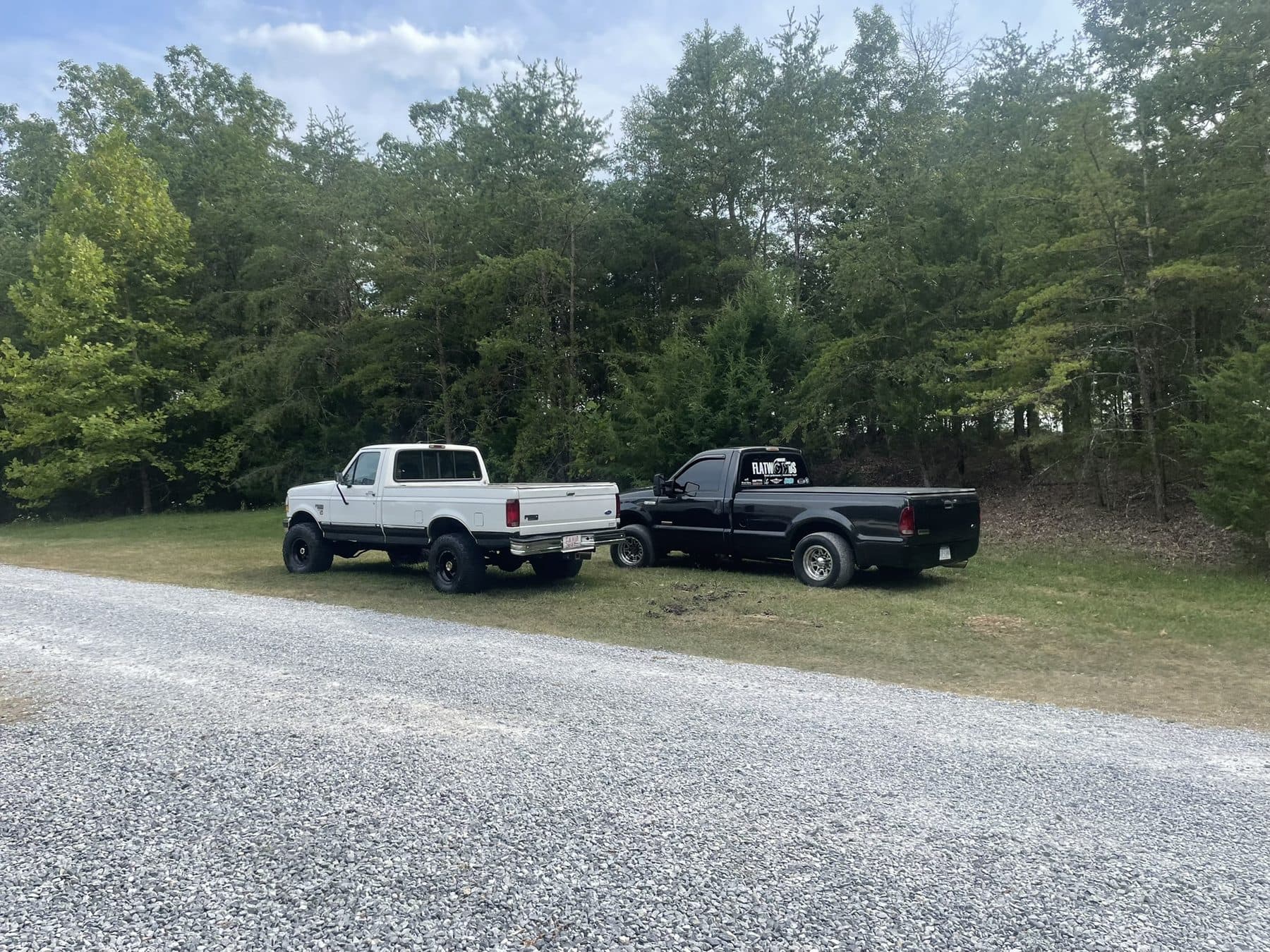 Chris's first truck next to the OG